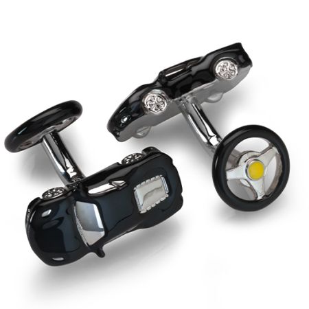 A pair of cufflinks in the shape of black sports cars. The back is the shape of a steering wheel.